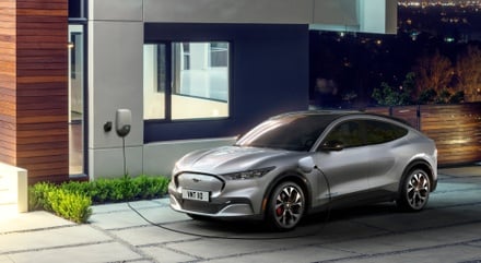charging a silver 2025 Ford Mustang Mach-E