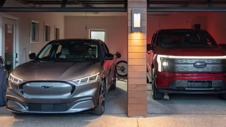 A Mustang Mach-E® and F-150 Lightning® parked side by side