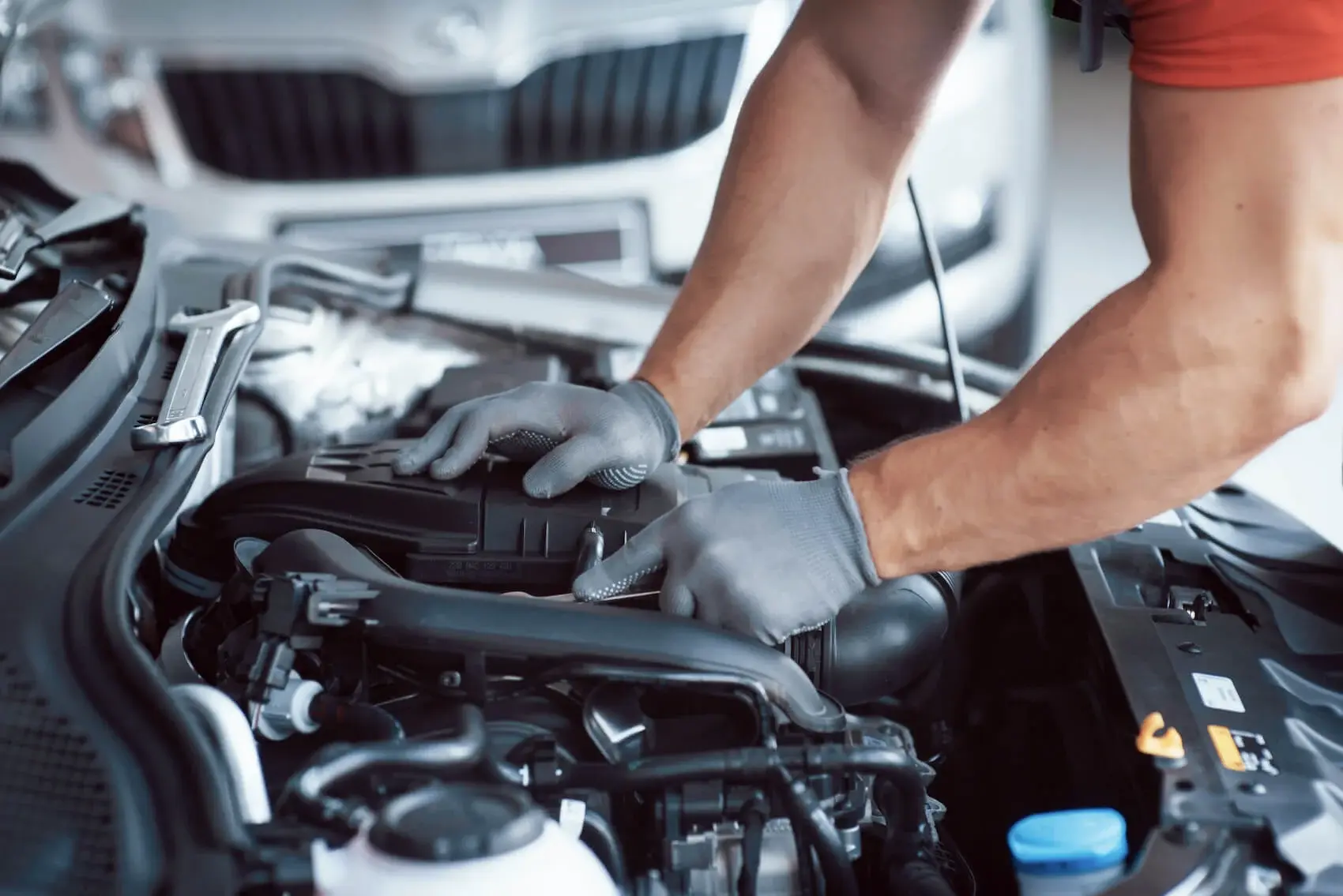Service Technician Working on Engine