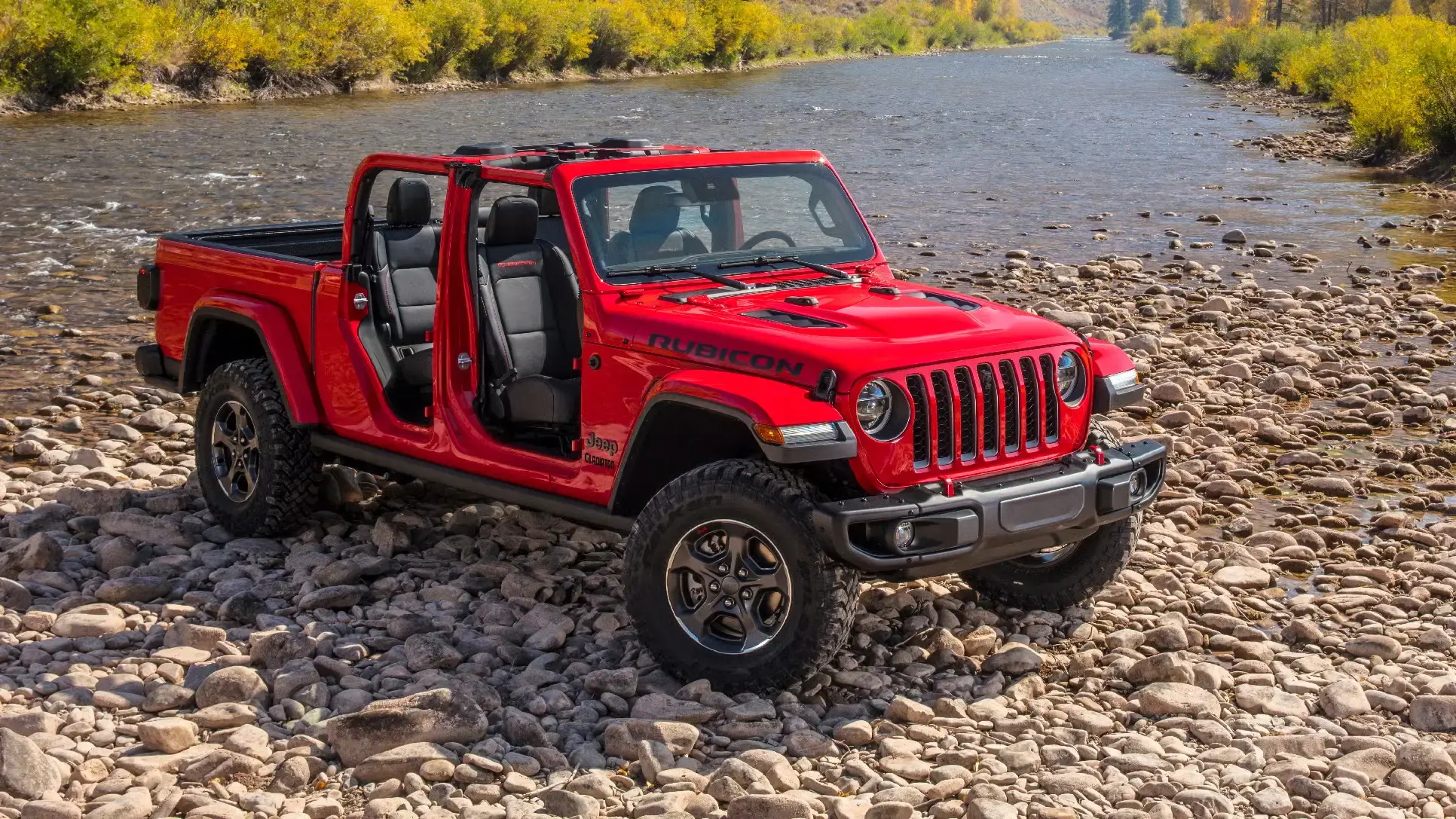 2020 Jeep Gladiator pickup truck overhead exterior shot with firecracker red paint color parked in the country