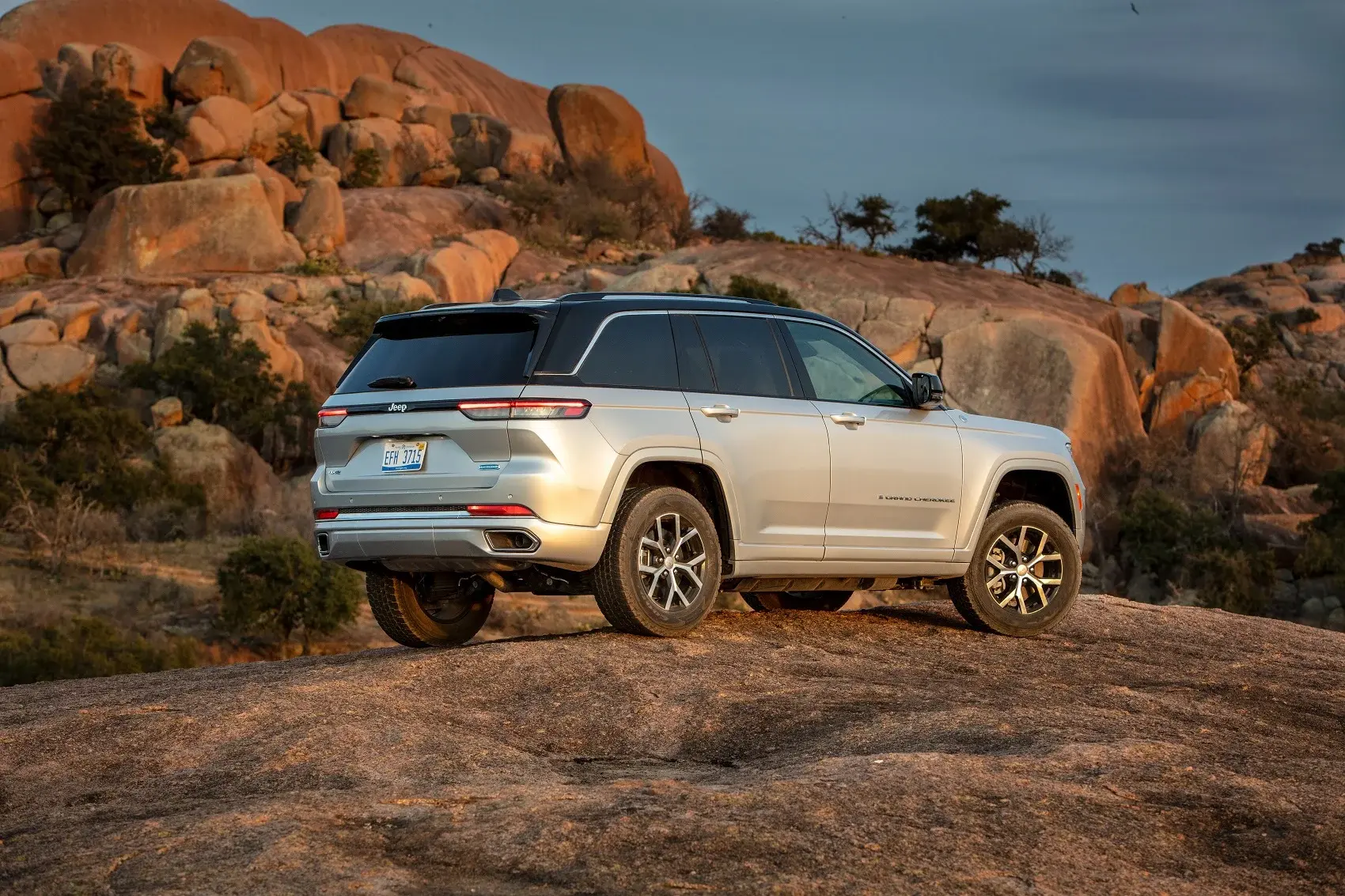 Jeep SUV parked on a hill in the desert