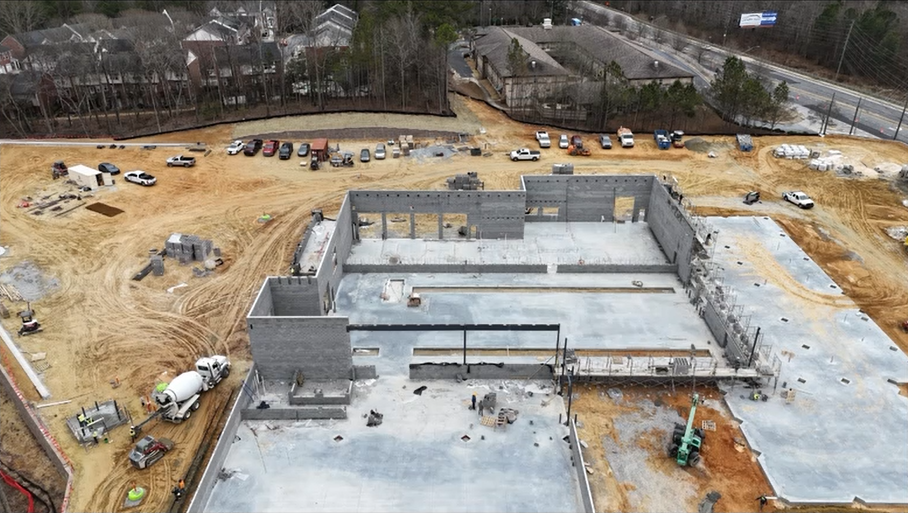  Active construction at Mercedes-Benz Buford service center with concrete work and equipment on site 