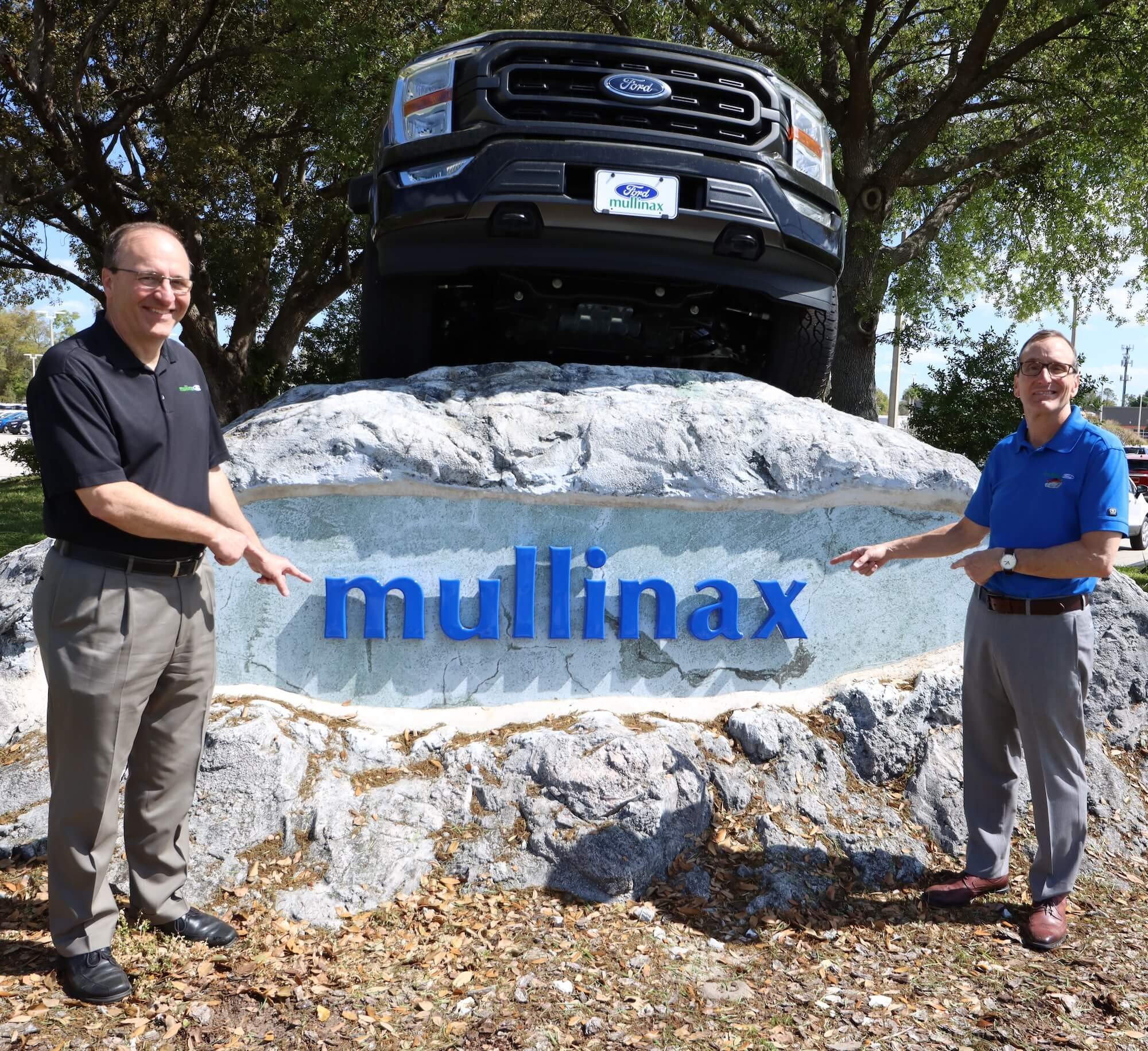 Mullinax Ford - Larry and Jerry with F-150 on Rock