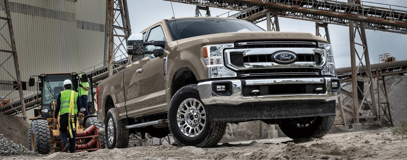 Tan 2022 Ford F-250 XLT at a construction site