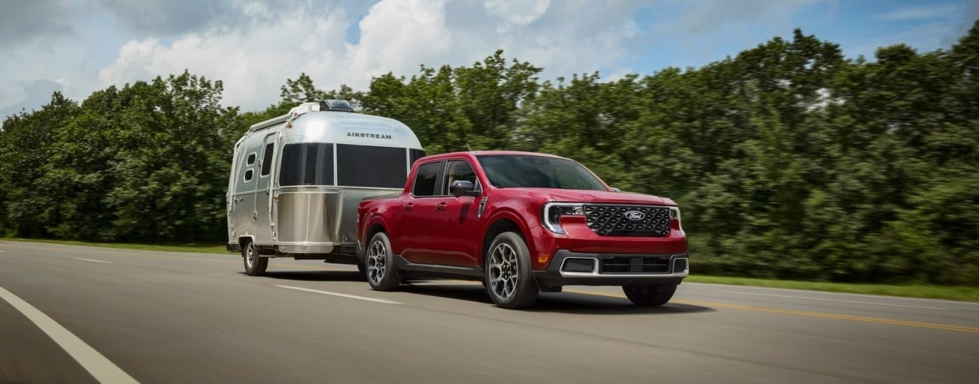 Red 2026 Ford Maverick driving to a Ford dealer near Mount Dora