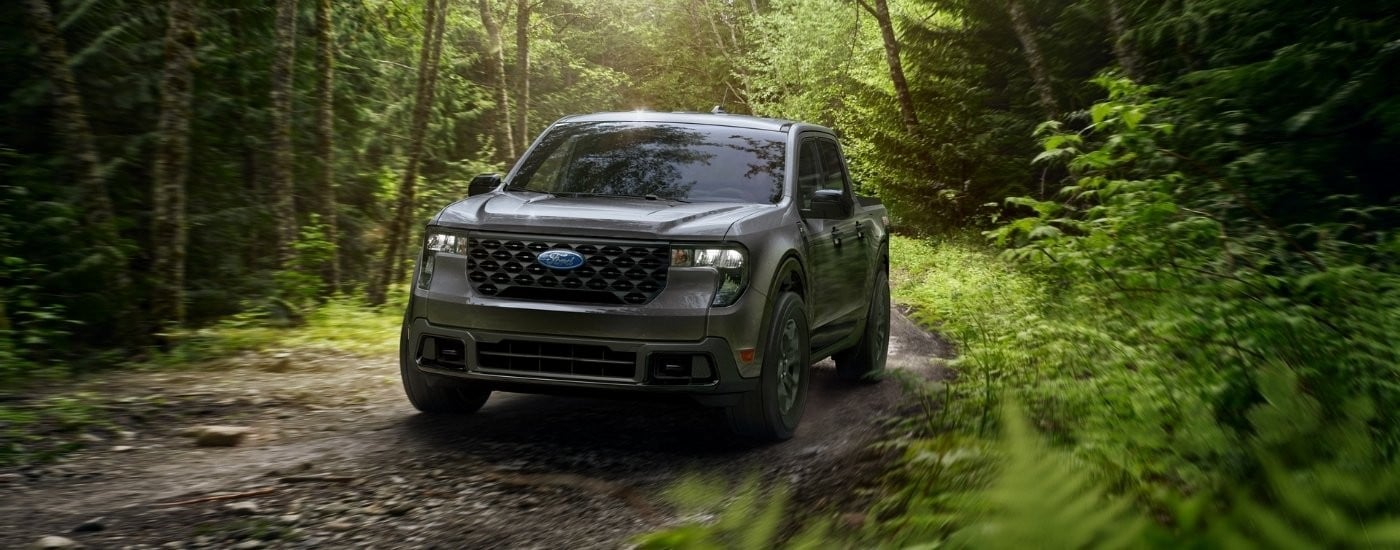 Grey 2026 Ford Maverick driving on a trail