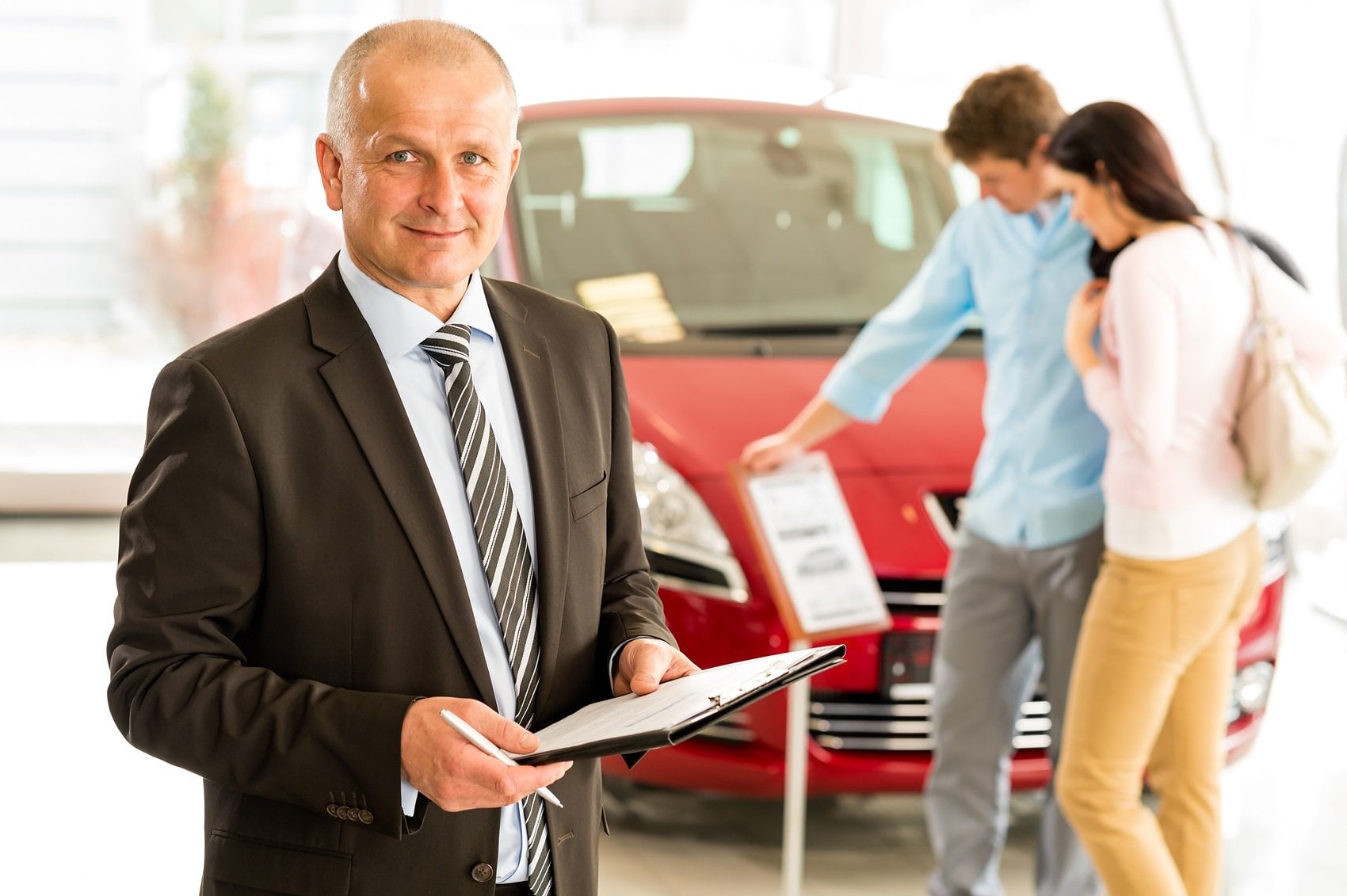 Couple Car Browsing at Dealership