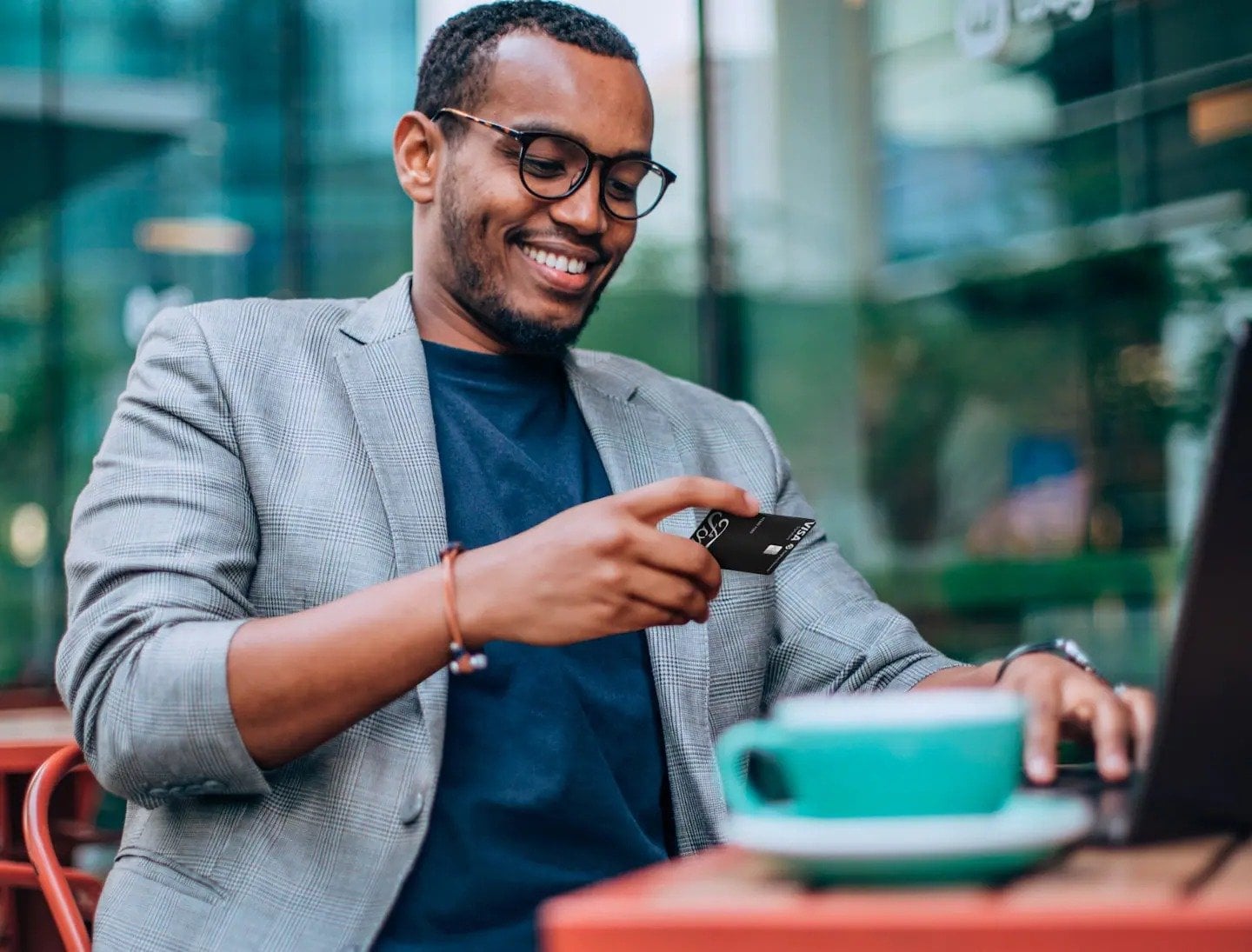 Veterans Ford man looking down at card and smiling