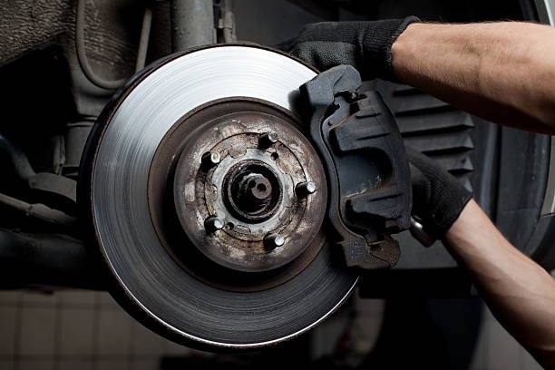 Brake job being conducted by mechanic at Westbury Toyota on Long Island, NY.