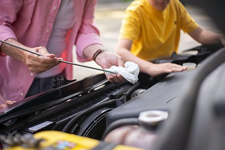 Checking transmission fluid on a Toyota on Long Island, NY.