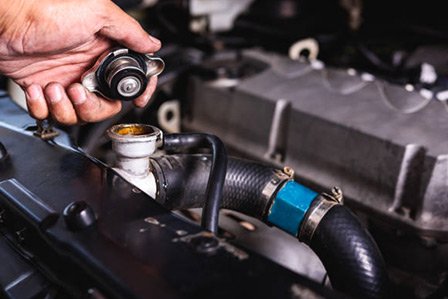 Westbury Toyota mechanic checking a radiator on Long Island, NY.