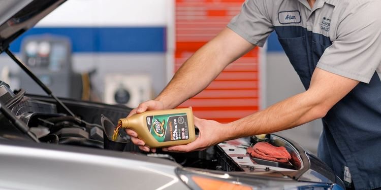 Hyundai Service Technician Performing Oil Change