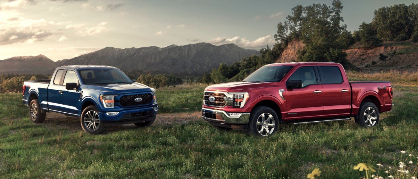 2021 Ford F150 two parked in field