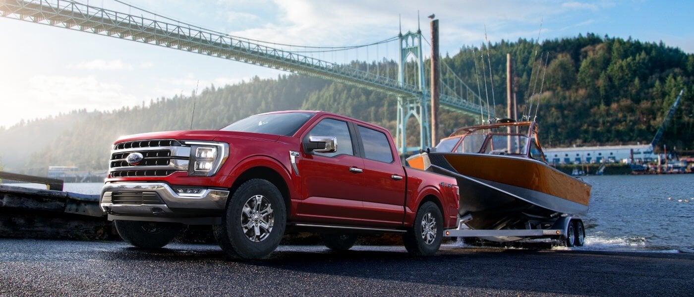 2021 Red Ford F-150 Towing a Boat out of Water