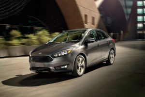 2018 Ford Focus sedan exterior front fascia and drivers side going fast on road
