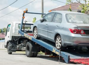 car being towed on trailer